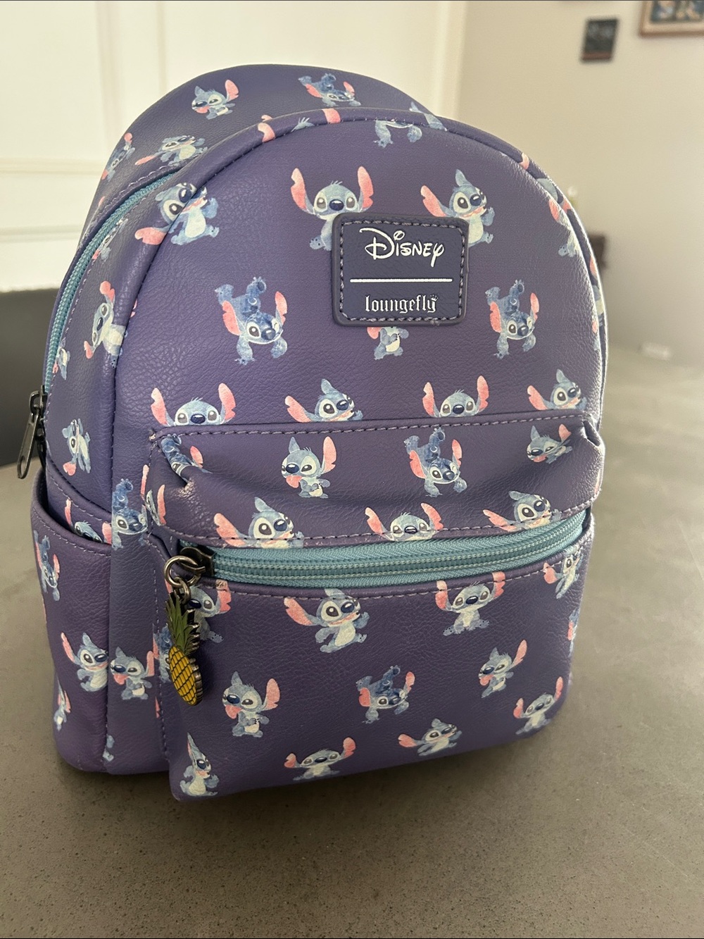 Loungefly Kids Purple Stitch Allover Print Mini Backpack with Pineapple Charm